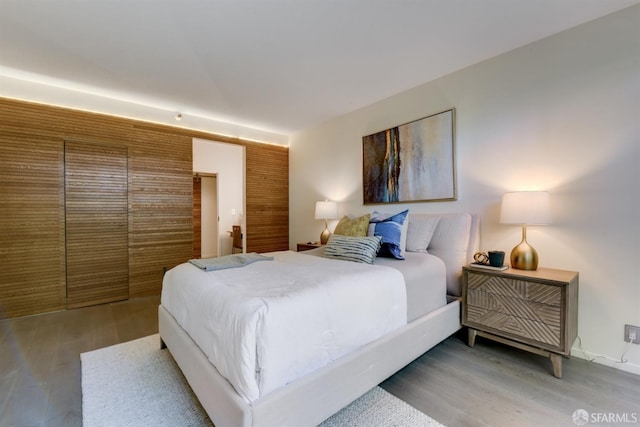 bedroom with wood finished floors