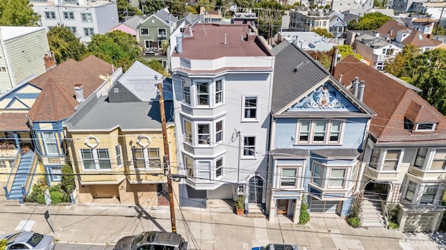 birds eye view of property with a residential view