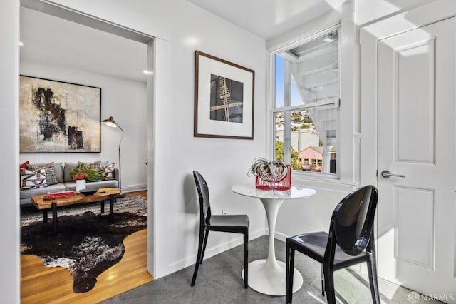 dining room with baseboards