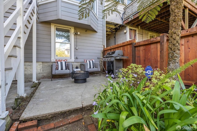 view of patio featuring grilling area and fence