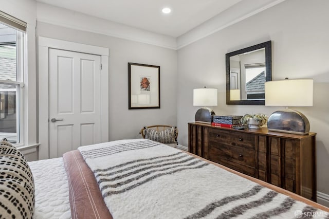 bedroom with recessed lighting and baseboards