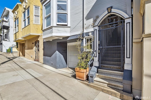 entrance to property with stucco siding