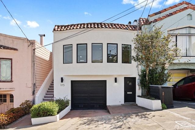 mediterranean / spanish house featuring a garage