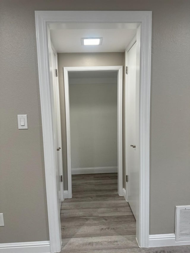 hall with light wood-type flooring