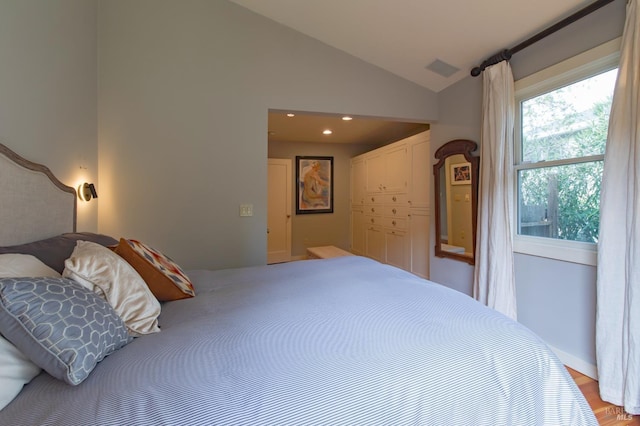 bedroom featuring recessed lighting, light wood-type flooring, lofted ceiling, and visible vents