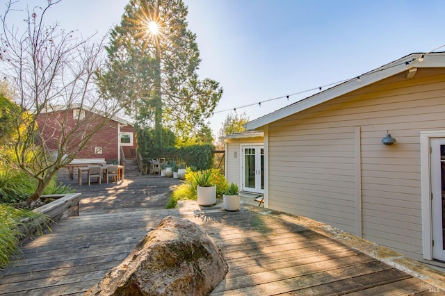 deck with french doors and entry steps