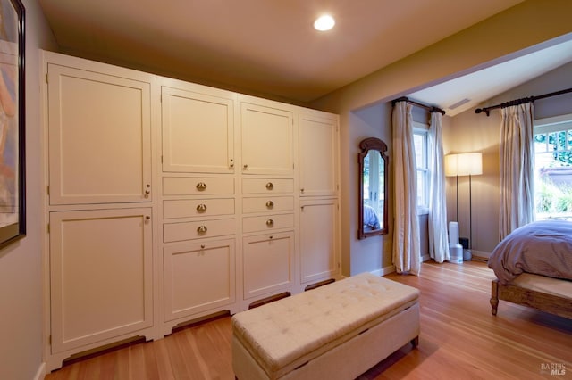 bedroom with recessed lighting, baseboards, light wood-type flooring, and lofted ceiling
