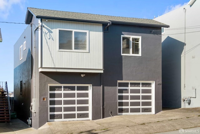 372 Baltimore Way, San Francisco, CA 94112 - view of front facade with a garage, driveway, stairway, and stucco siding