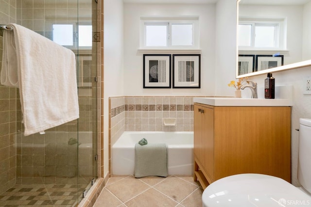 372 Baltimore Way, San Francisco, CA 94112 - full bath with vanity, plenty of natural light, a garden tub, a shower stall, and tile walls