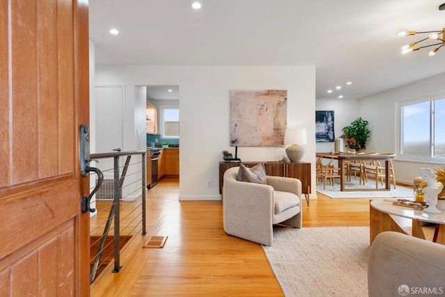 372 Baltimore Way, San Francisco, CA 94112 - living area with light wood finished floors, a chandelier, and recessed lighting