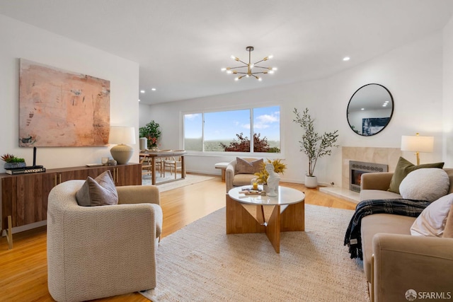 372 Baltimore Way, San Francisco, CA 94112 - living room with light wood-type flooring, a high end fireplace, a chandelier, and recessed lighting