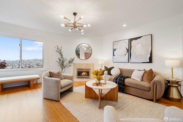 372 Baltimore Way, San Francisco, CA 94112 - living room with a chandelier, light wood-type flooring, a lit fireplace, and recessed lighting