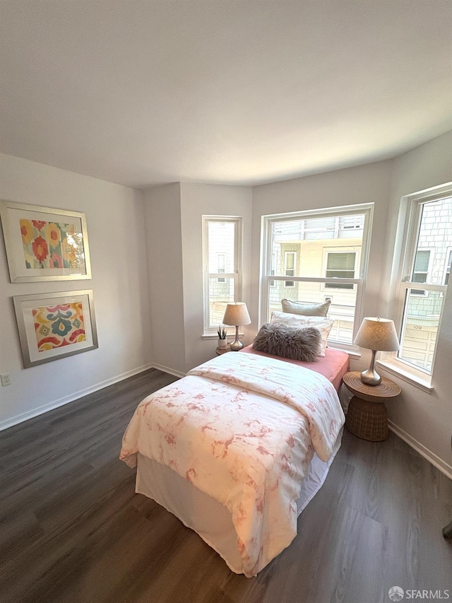 450 Carl St, San Francisco, CA 94117 - bedroom featuring dark wood-style floors and multiple windows