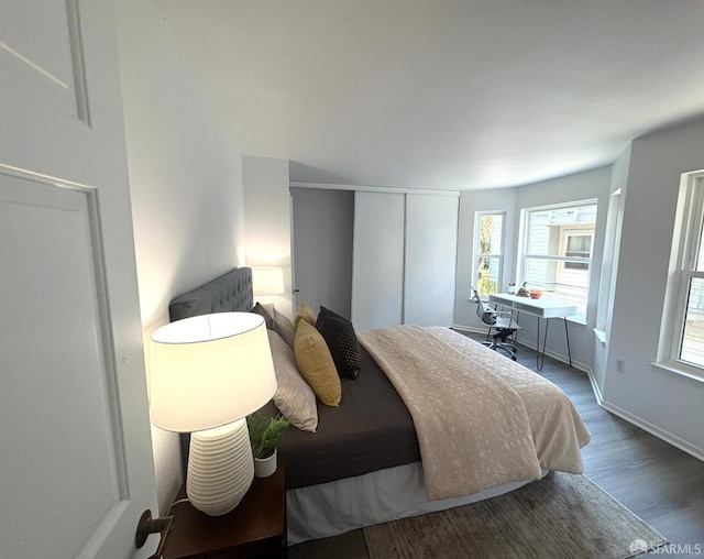 450 Carl St, San Francisco, CA 94117 - bedroom featuring wood finished floors and baseboards