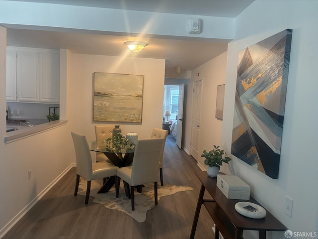 450 Carl St, San Francisco, CA 94117 - dining room with dark wood-style flooring and baseboards