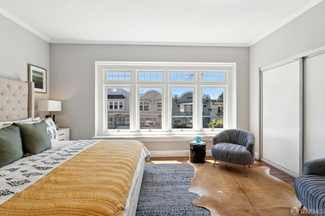 510 11th Ave, San Francisco, CA 94118 - bedroom featuring ornamental molding, wood finished floors, and a closet