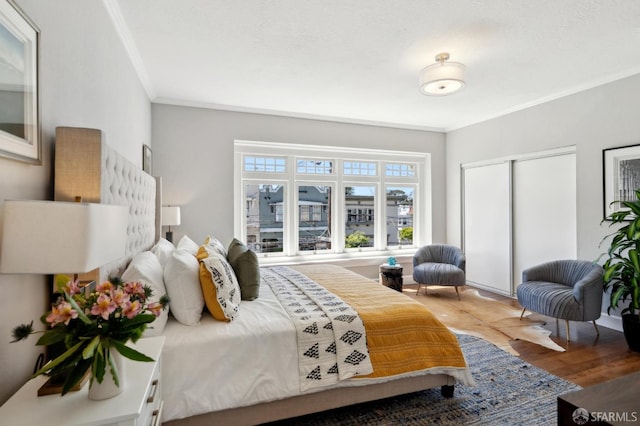 510 11th Ave, San Francisco, CA 94118 - bedroom with crown molding, wood finished floors, and a closet