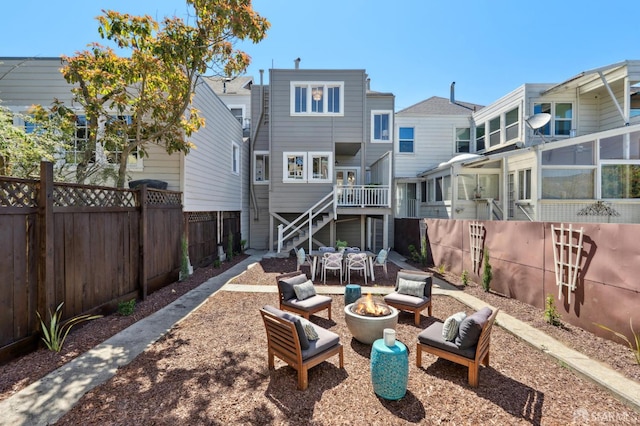 510 11th Ave, San Francisco, CA 94118 - back of property featuring stairs, a fenced backyard, a patio, and an outdoor living space with a fire pit
