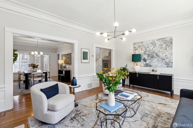 510 11th Ave, San Francisco, CA 94118 - living area featuring a chandelier, crown molding, and wood finished floors