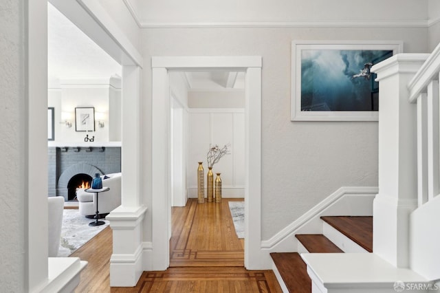 510 11th Ave, San Francisco, CA 94118 - corridor with wood finished floors, stairs, crown molding, and a textured wall