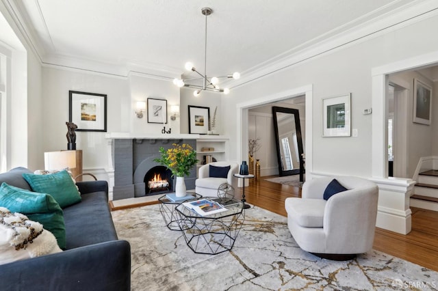 510 11th Ave, San Francisco, CA 94118 - living area with ornamental molding, wood finished floors, a brick fireplace, and a chandelier
