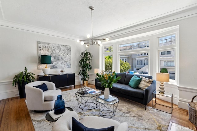 510 11th Ave, San Francisco, CA 94118 - living room with wood finished floors, a chandelier, a textured ceiling, and crown molding