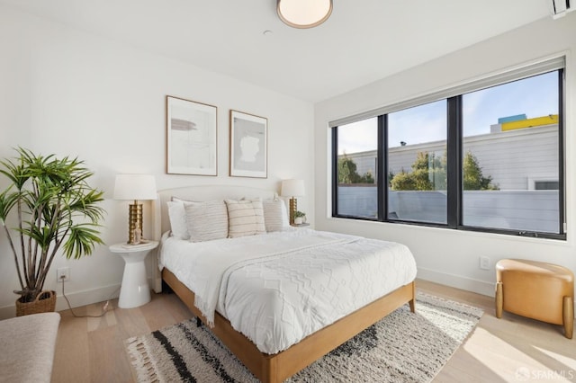 bedroom featuring light wood-type flooring