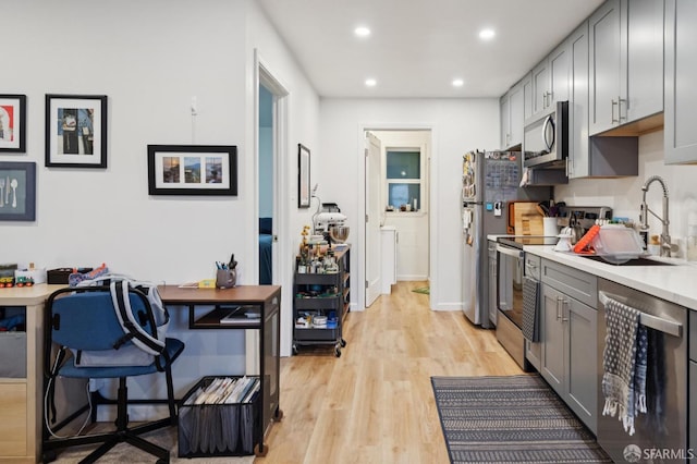 968-970 Broadway, San Francisco, CA 94133 - kitchen featuring stainless steel appliances, gray cabinets, recessed lighting, light wood-type flooring, and light countertops