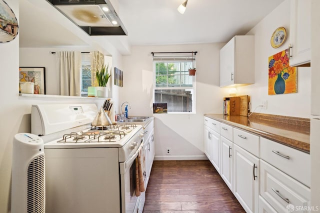 968-970 Broadway, San Francisco, CA 94133 - kitchen featuring white gas range oven, dark wood-style flooring, white cabinets, and ventilation hood