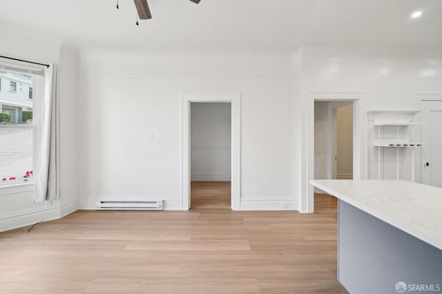 968-970 Broadway, San Francisco, CA 94133 - empty room featuring a baseboard heating unit, a ceiling fan, and light wood-type flooring