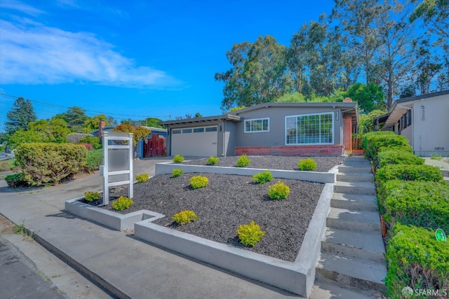 4330 Jana Vista Rd, El Sobrante, CA 94803 - ranch-style home featuring brick siding, an attached garage, driveway, stucco siding, and a chimney