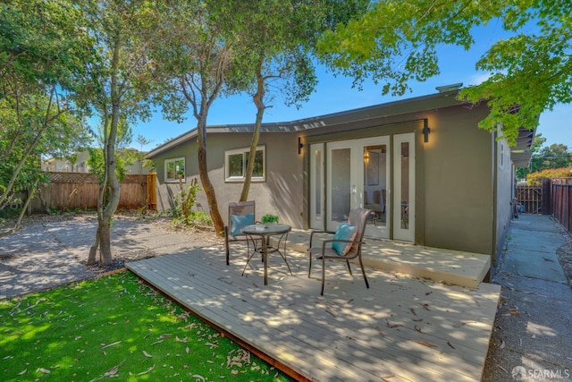 4330 Jana Vista Rd, El Sobrante, CA 94803 - rear view of property featuring stucco siding, a wooden deck, a fenced backyard, and french doors