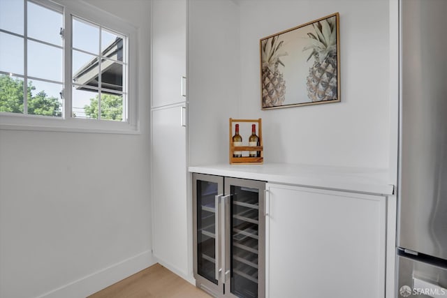 4330 Jana Vista Rd, El Sobrante, CA 94803 - indoor dry bar with beverage cooler, light wood-style flooring, baseboards, and freestanding refrigerator