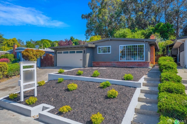 4330 Jana Vista Rd, El Sobrante, CA 94803 - ranch-style home with a garage, stucco siding, driveway, brick siding, and a chimney