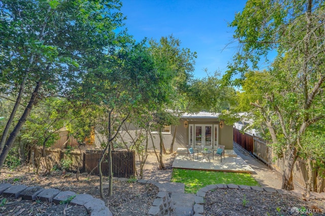4330 Jana Vista Rd, El Sobrante, CA 94803 - back of property featuring french doors, a fenced backyard, stucco siding, and a patio area