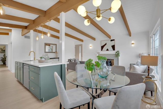 4330 Jana Vista Rd, El Sobrante, CA 94803 - dining space with a chandelier, a fireplace, and light wood finished floors