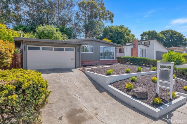 4330 Jana Vista Rd, El Sobrante, CA 94803 - single story home with driveway, an attached garage, brick siding, and stucco siding