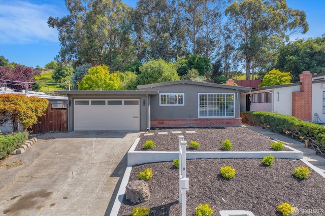 4330 Jana Vista Rd, El Sobrante, CA 94803 - ranch-style house featuring an attached garage, concrete driveway, and stucco siding