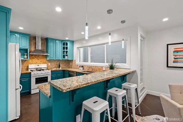 1871 Alemany Blvd, San Francisco, CA 94112 - kitchen with white appliances, wall chimney range hood, a peninsula, a sink, and blue cabinets