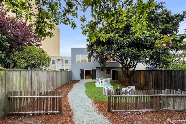 1871 Alemany Blvd, San Francisco, CA 94112 - back of house featuring a fenced backyard, stucco siding, and a patio area