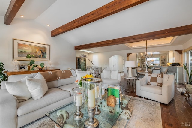 living area featuring arched walkways, lofted ceiling with beams, hardwood / wood-style floors, an inviting chandelier, and stairs