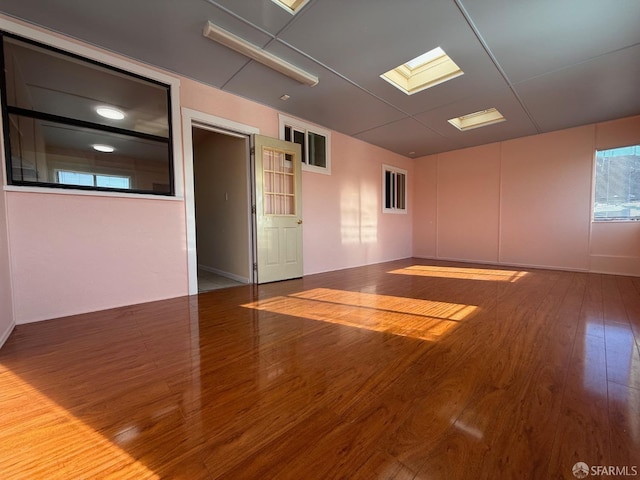 unfurnished room with hardwood / wood-style flooring