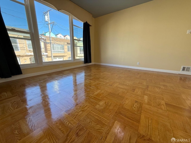 empty room with light parquet flooring