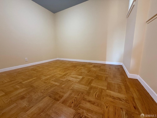 spare room with light parquet flooring