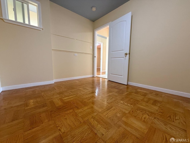 empty room with light parquet floors