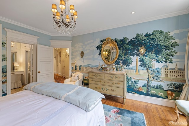 bedroom with crown molding, ensuite bath, hardwood / wood-style floors, and a notable chandelier