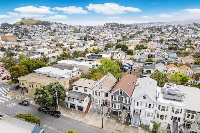 drone / aerial view featuring a residential view and a mountain view