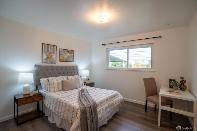 bedroom featuring dark hardwood / wood-style flooring