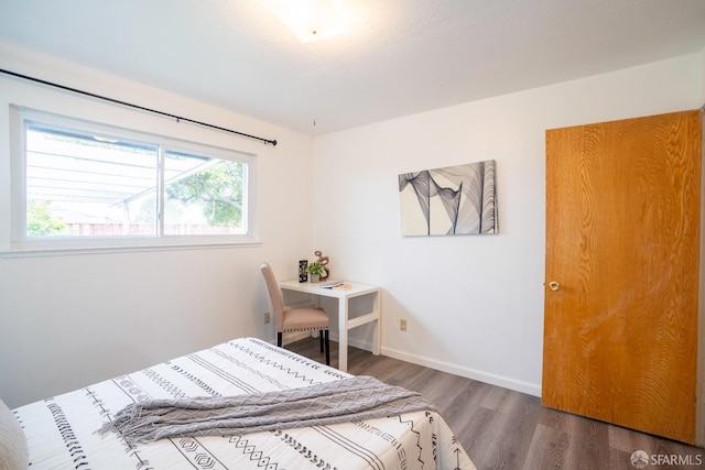 bedroom featuring hardwood / wood-style flooring