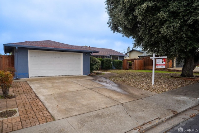 ranch-style house featuring a garage